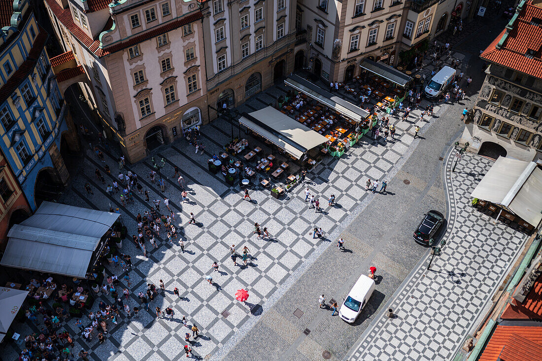 View of tourists, shops and restaurants from the tower of the Old Town Hall in Prague