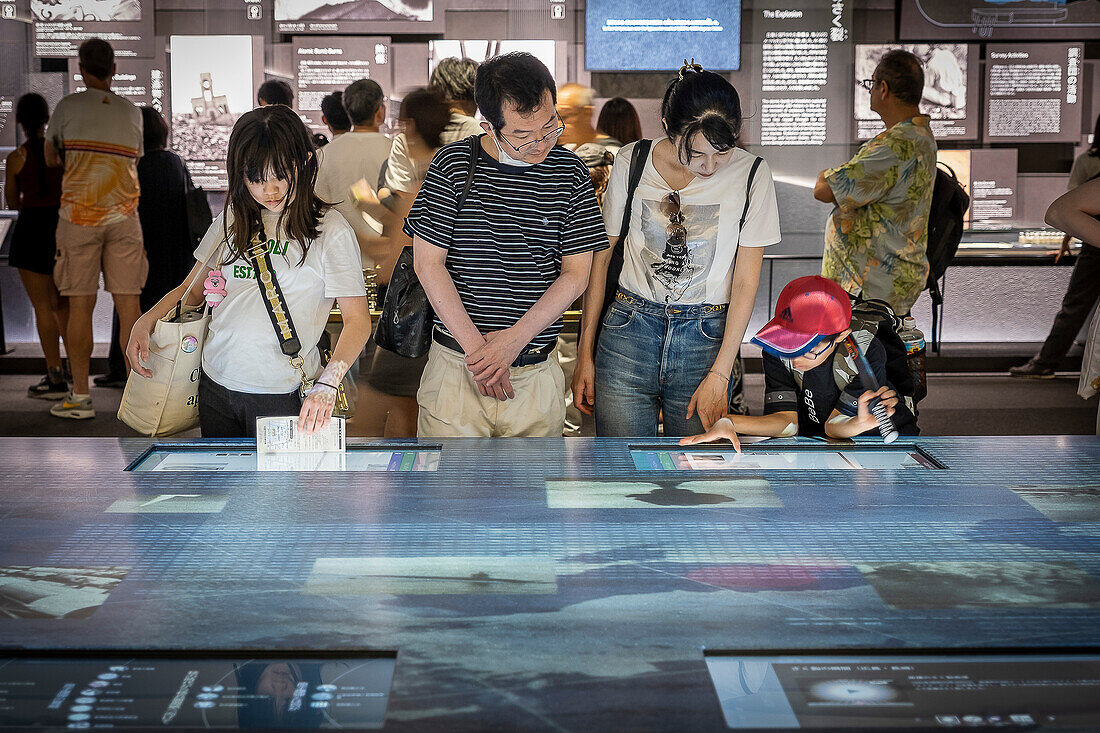 Exploring museum materials. Exhibition inside the Hiroshima Peace Memorial Museum, Hiroshima, Japan