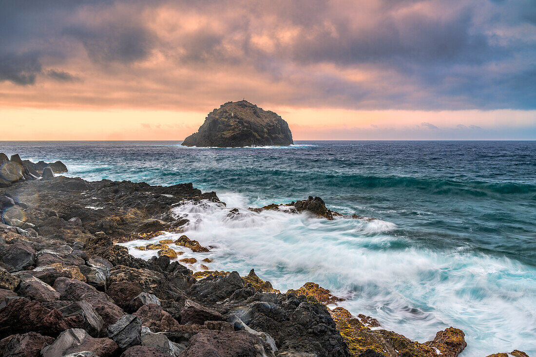 Dramatic long exposure of the rocky coastline of Garachico in Northern Tenerife, Canary Islands, Spain. Captures the rugged beauty and power of the ocean.