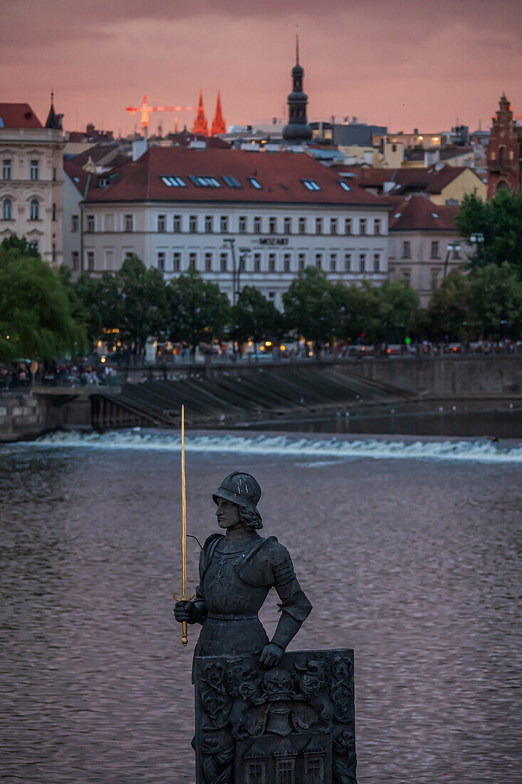 Bruncvik soldier with a sword statue and View of Vltava River from Charles Bridge in Prague