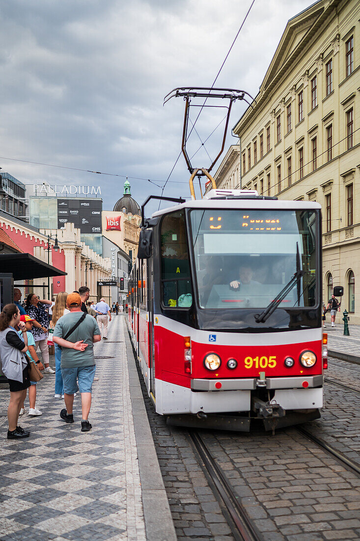 People waiting for the tram in Prague