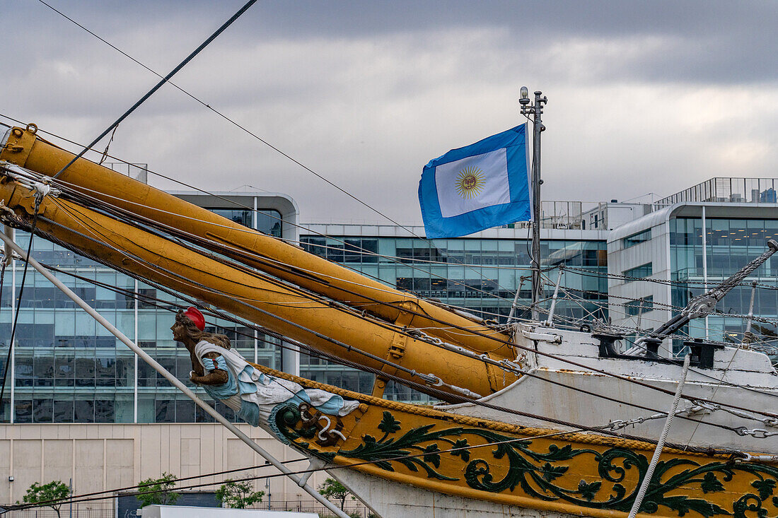 Detail view of the bow & figurehead of the ARA Presidente Sarmiento, a museum ship in Puerto Madero, Buenos Aires, Argentina. The Argenine naval jack is also shown.