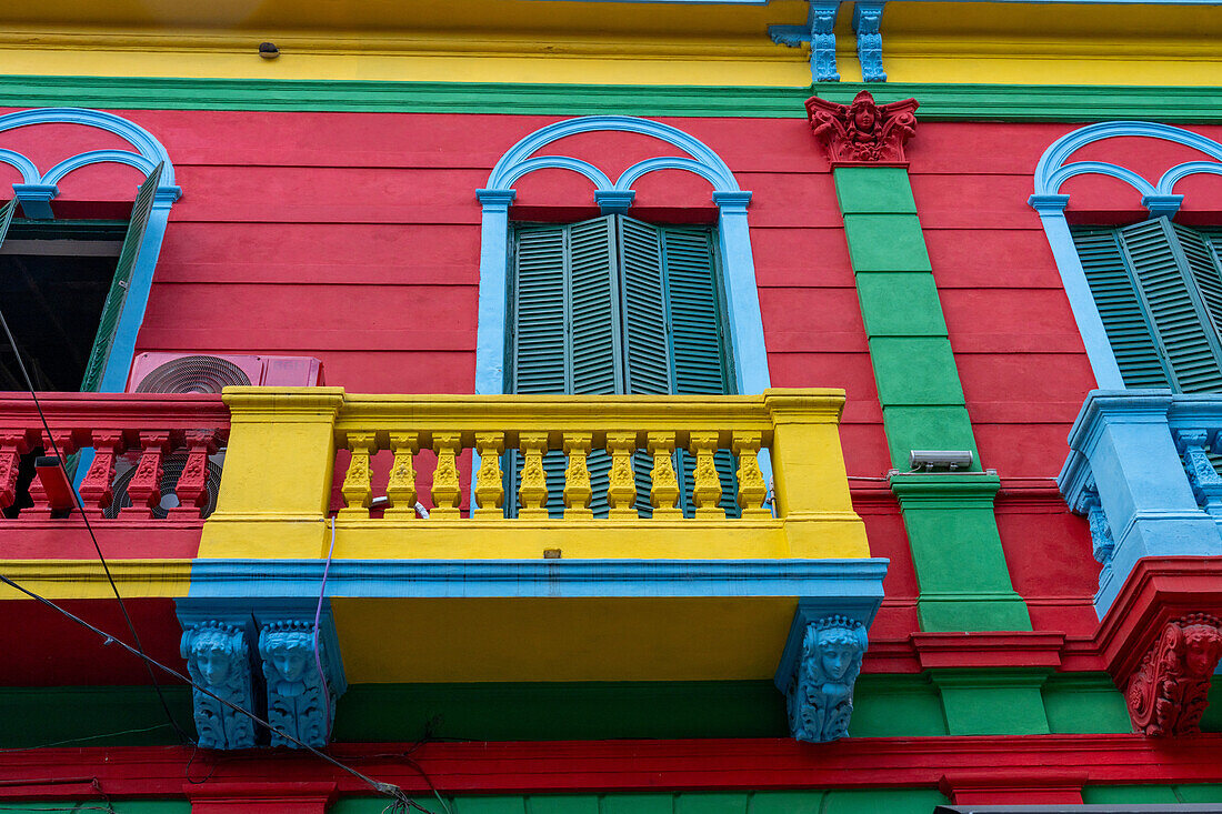 A colorfully painted balcony on a building on Magallanes Street in Caminito in La Boca, Buenos Aires, Argentina.