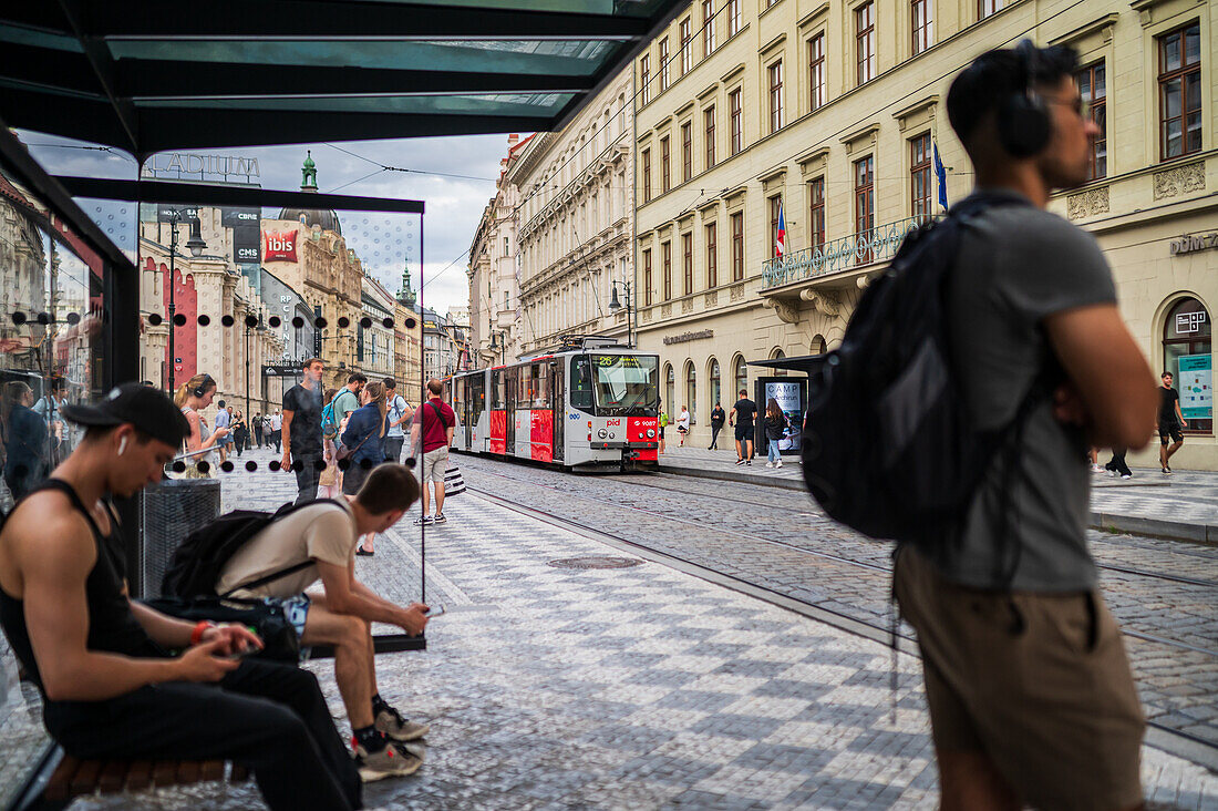 People waiting for the tram in Prague