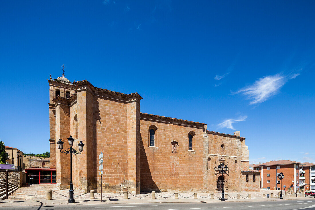 A wide shot of the Colegiata Concatedral de San Pedro in Soria, Spain. The church is a beautiful example of Romanesque architecture