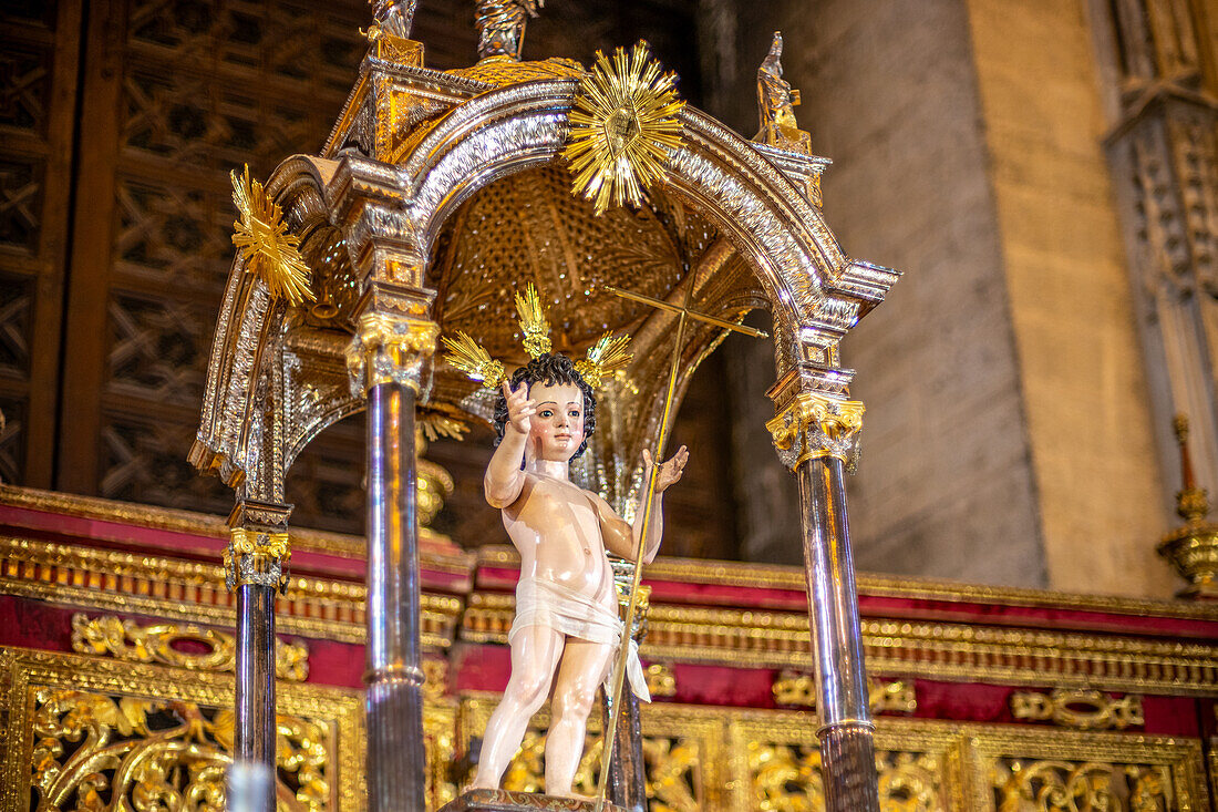 Seville, Spain, Oct 23 2016, Detailed close up of the Niño Jesus statue by Martinez Montañes inside the historic Catedral de Sevilla, Spain, showcasing intricate craftsmanship and religious symbolism.