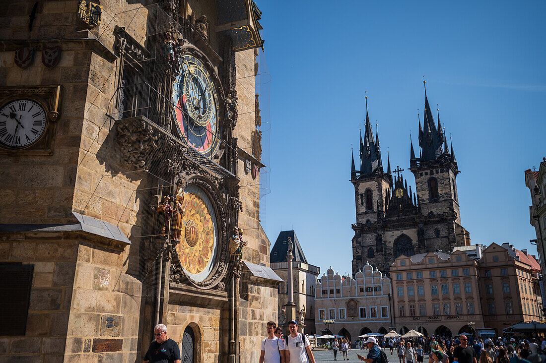 Astronomical Clock in Old Town Hall tower and Church of Our Lady before Tyn, Prague