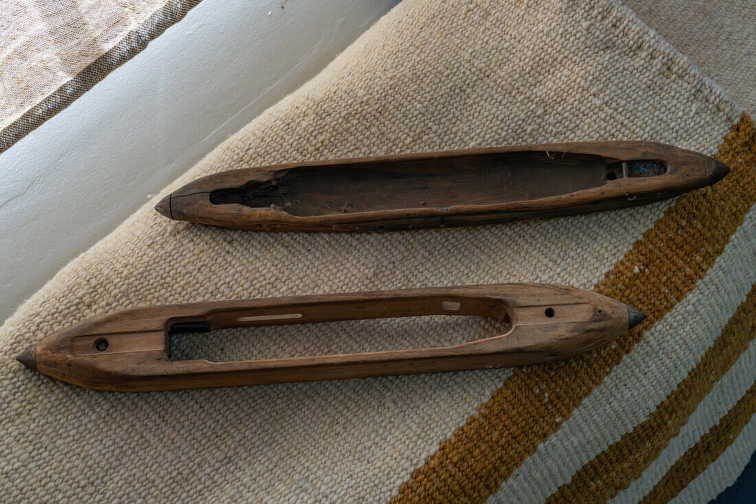 Vintage antique wooden boat shuttles for weaving at Hilandería Warmi, a weaving mill in Palpalá, Argentina.