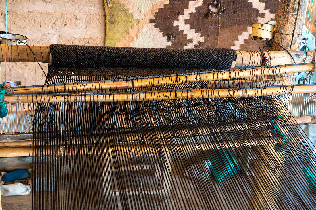 A wooden foot loom in a home weaving workshop in Seclantas, Argentina in the Calchaqui Valley.