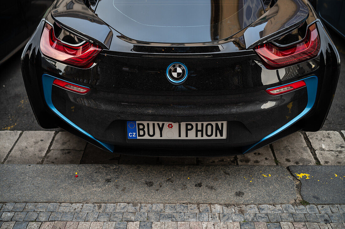 BMW car plate reads Buy IPhon, Prague