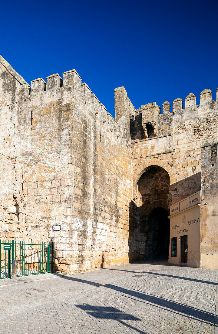 Carmona, Spain, Jan 8 2009, Discover the ancient Sevilla gate in Carmona, a stunning example of Moorish architecture against a clear blue sky.