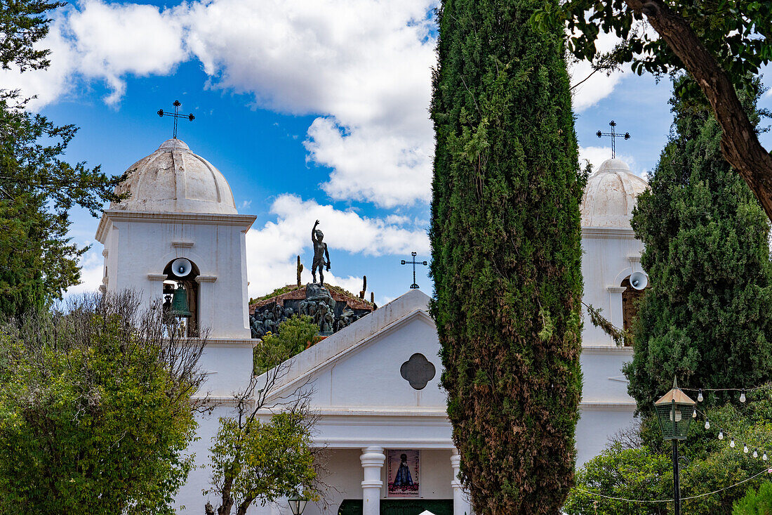 The Cathedral of Our Lady of Candelaria in Humahuaca in the Humahuaca Valley or Quebrada de Humahuaca, Argentina. On the hilltop behind is the Monument to the Heroes of Independence.