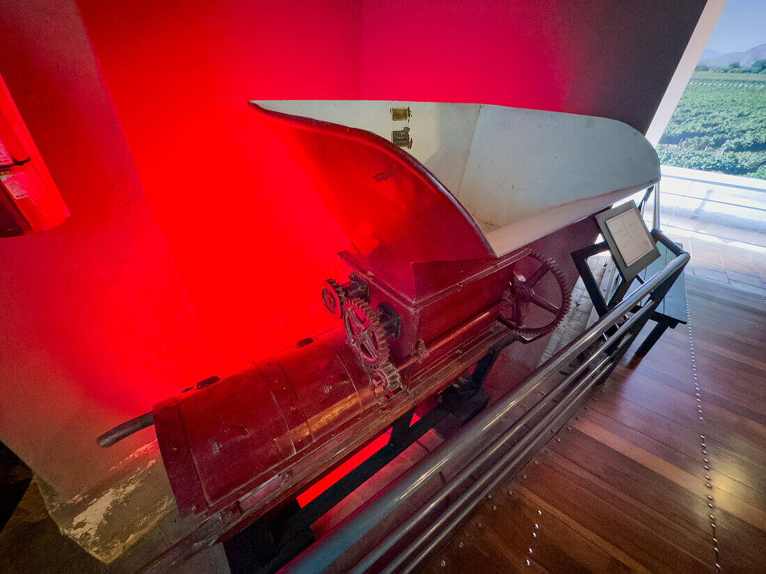 A vintage roller grinder or continuous press in the Museo de la Vid y el Vino or Museum of the Vine and the Wine in Cafayate, Argentina.