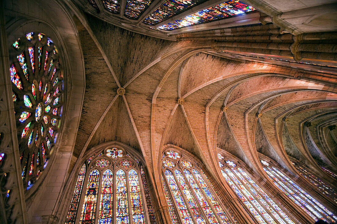 Leon, Spain, Aug 21 2008, The grand central nave of León Cathedral features intricate stained glass windows illuminating the space with vibrant colors.