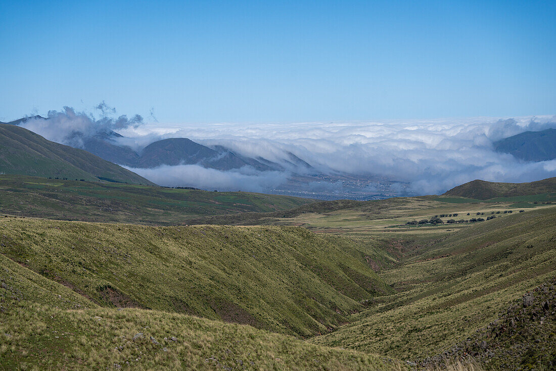 Low clouds blanket the mountains around the town of Tafí in Argentina as seen from the Mirador El Infiernillo.