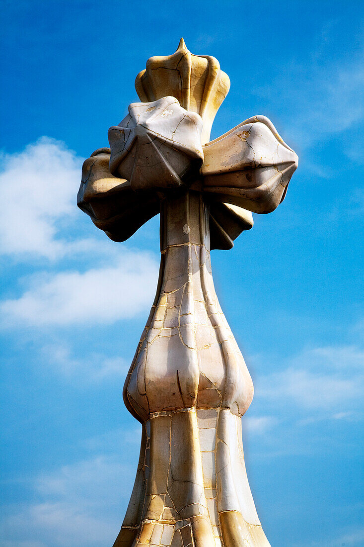 Barcelona, Spain, Sept 4 2008, The cross atop Casa Batlló reflects Gaudís distinctive architectural style against a clear blue sky in Barcelona.