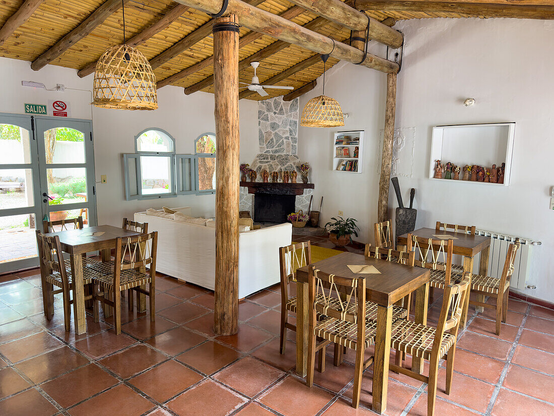 Fireplace and decor of the breakfast room in the Pumahuasi Boutique Hotel, a small tourist hotel in Purmamarca, Argentina.