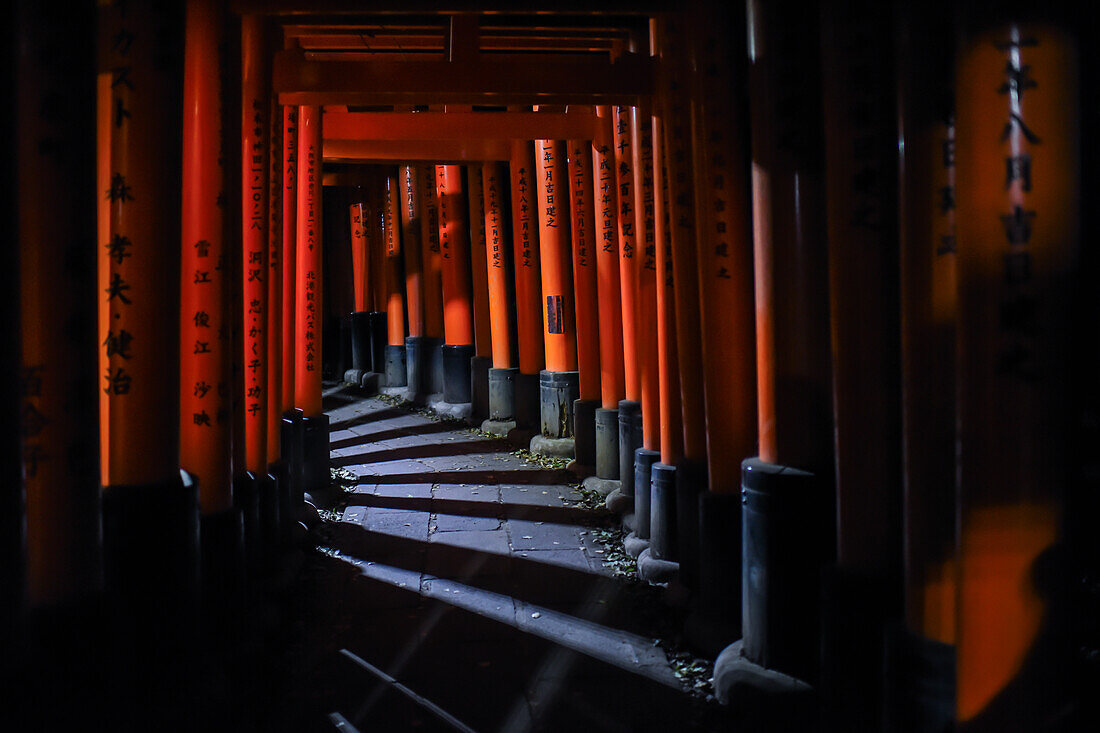 Exploring Fushimi Inari Taisha temple at night, Kyoto, Japan