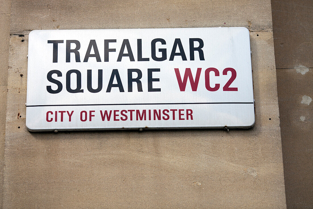 A sign indicating Trafalgar Square in the City of Westminster, an iconic London location known for its historical significance.