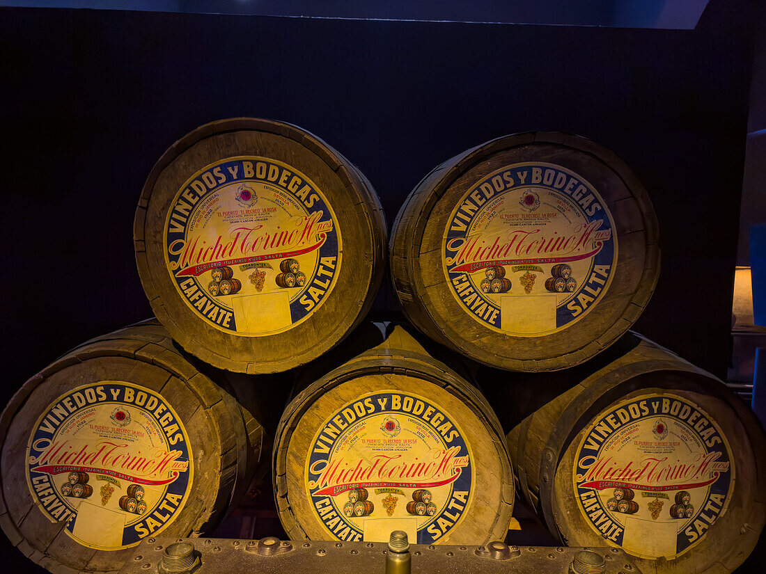 Vintage wine barrels from a local winery in the Museo de la Vid y el Vino or Museum of the Vine and the Wine in Cafayate, Argentina.