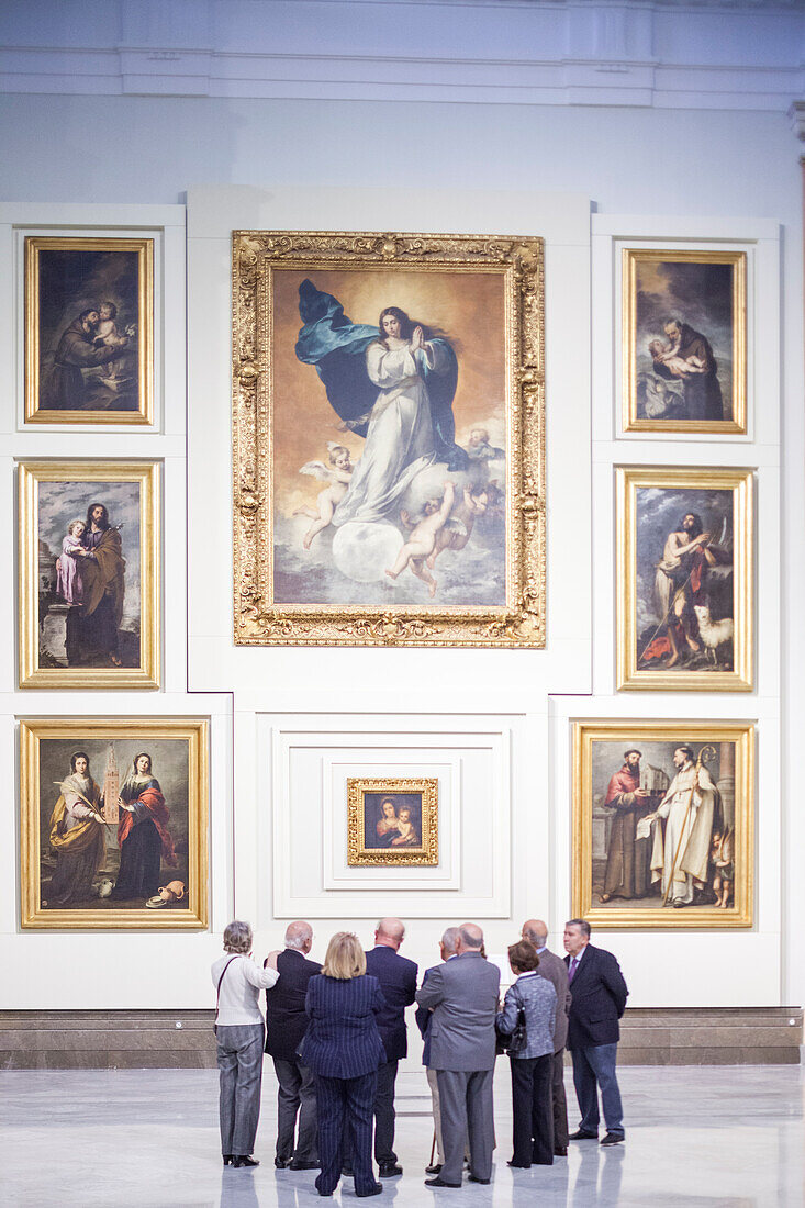 Seville, Spain, Mar 21 2009, Groups of visitors explore the Sevillian Baroque room, appreciating exquisite artworks in the Museum of Fine Arts in Seville, Spain.