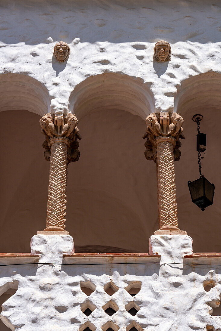 Detail of the Spanish & Moorish-style town hall or cabildo on Plaza Gomez in Humahuaca, Argentina. The capitals of the Moorish tile columns are condor heads carved of stone.