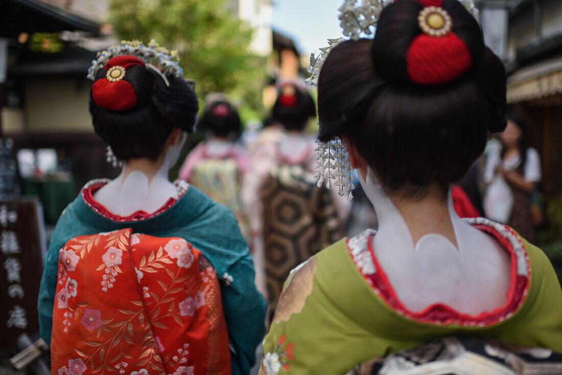 Group of women dressed as Maikos in the streets of Kyoto, Japan