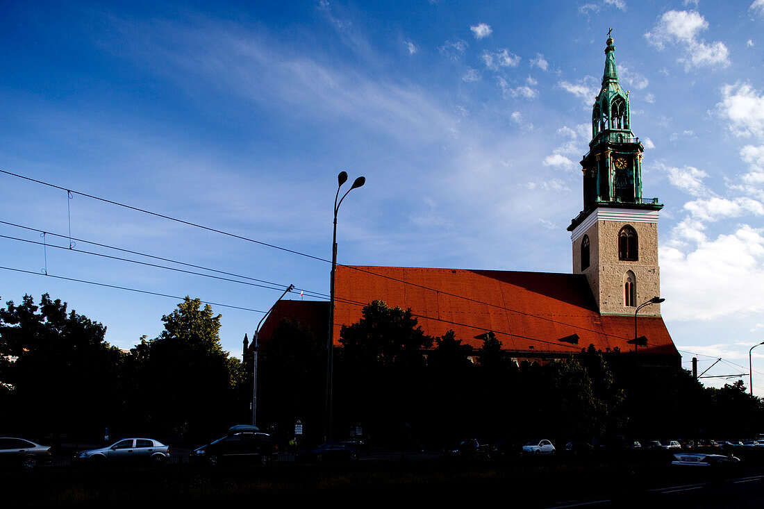 The historic Marienkirche stands prominently in Berlin\'s Mitte district, highlighting its stunning architecture and vibrant surroundings.