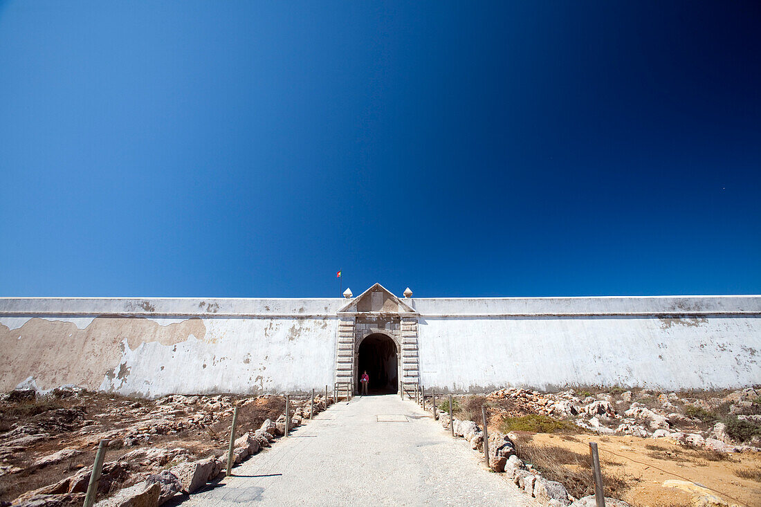 Sagres Fortress stands majestically against a clear blue sky in southern Portugal, highlighting its historic architecture.