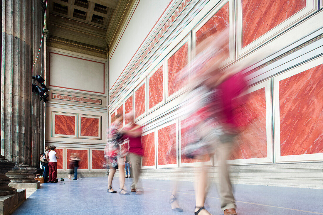 Berlin, Germany, July 24 2009, Dancers gracefully engage in tango, filling the historic portico at the Altes Museum in Berlin with rhythm and passion.