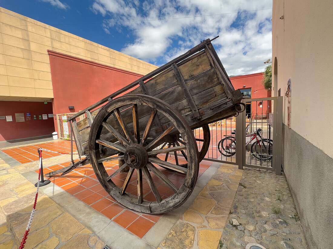 A vintage wooden cart for hauling wine barrels at the Museo de la Vid y el Vino or Museum of the Vine and the Wine in Cafayate, Argentina.