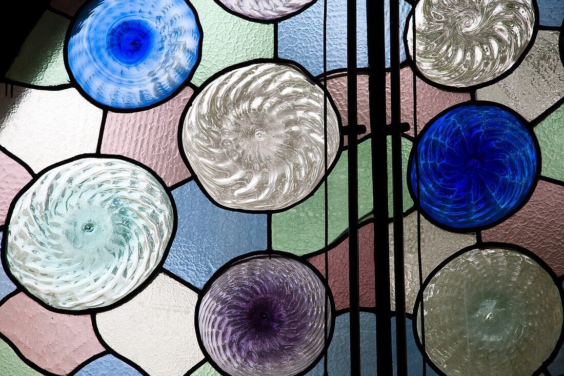 Barcelona, Spain, Sept 4 2008, Vibrant stained glass with swirling patterns enhances the beauty of Casa Batlló, a Gaudí masterpiece in Barcelona.