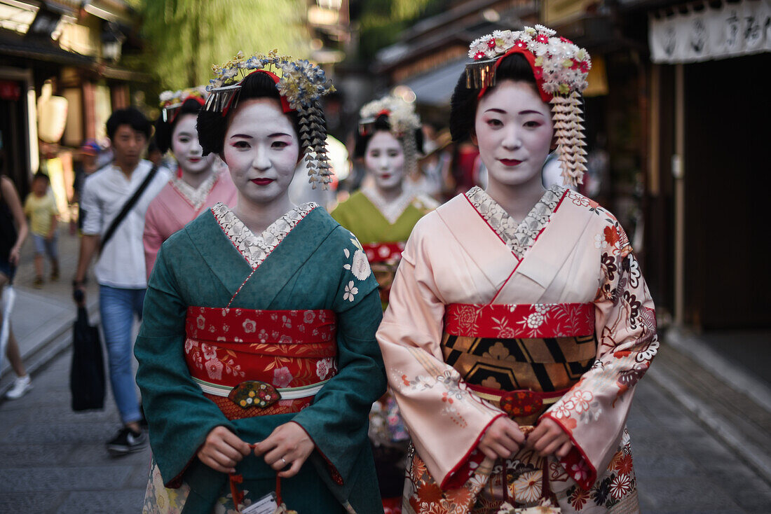 Group of women dressed as Maikos in the streets of Kyoto, Japan