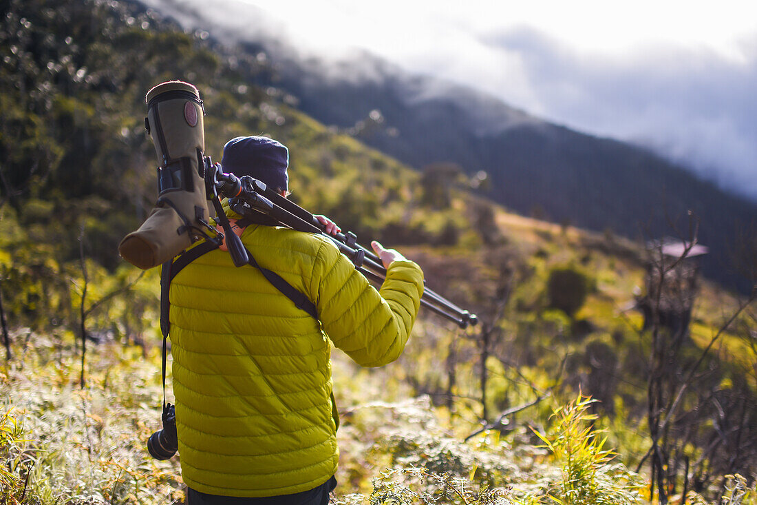 Young man hiking in the mountains of Sierra Nevada de Santa Marta, Colombia