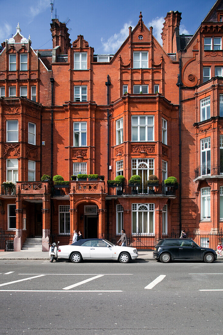 London, UK, May 3 2009, A striking Victorian building showcases red brick design and intricate details on Pont Street in Kensington, London.