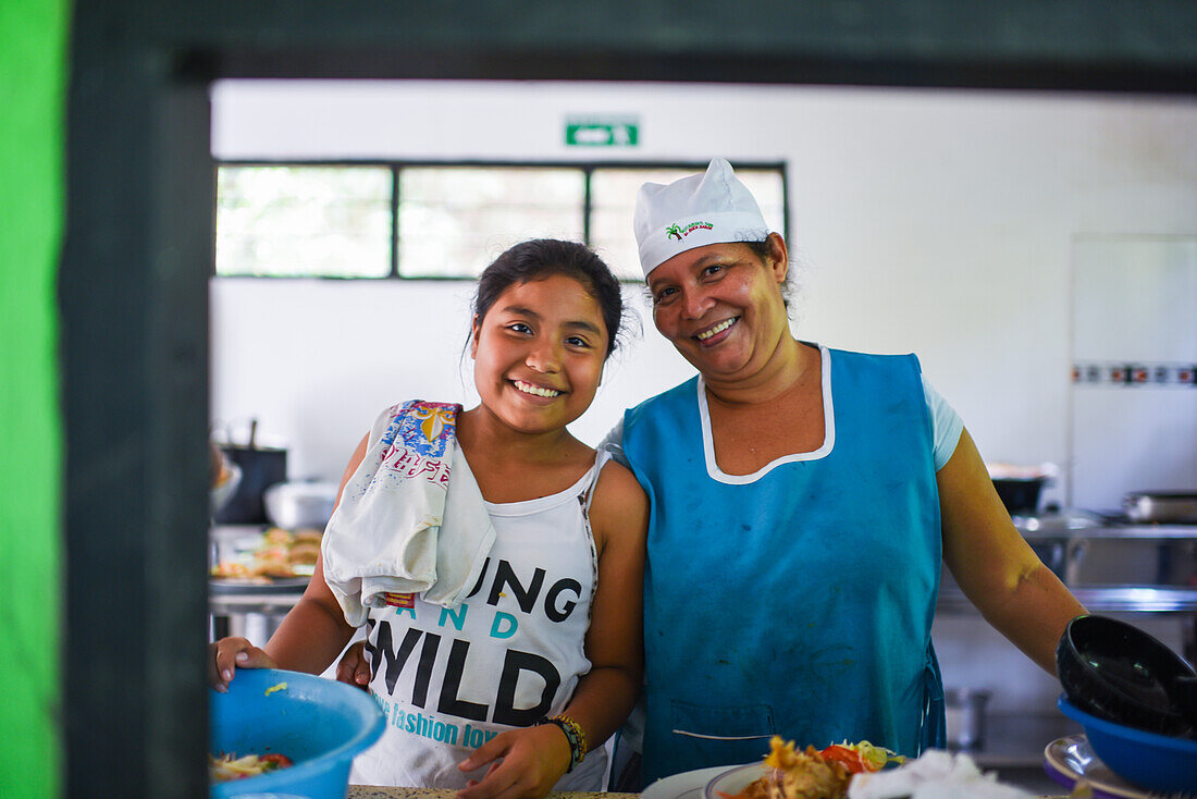 Portrait of young female cook assistant and cook in Colombia