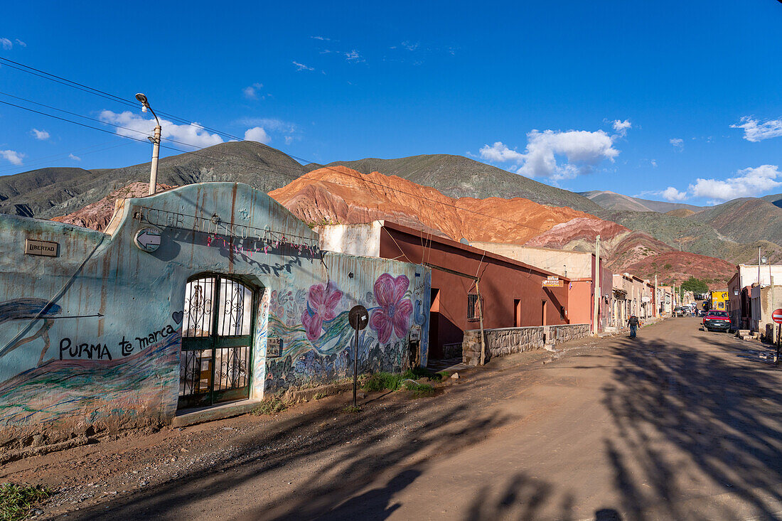 The gate of the Santa Rosa Athletic Club in Purmamarca, Argentina, on Calle Libertad with the Hill of Seven Colors behind.