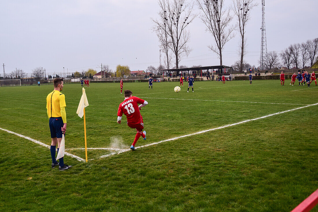 Corner kick during soccer youth game in small town of Hungary