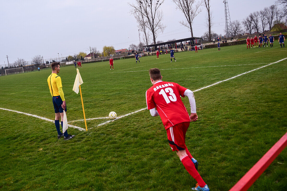 Corner kick during soccer youth game in small town of Hungary