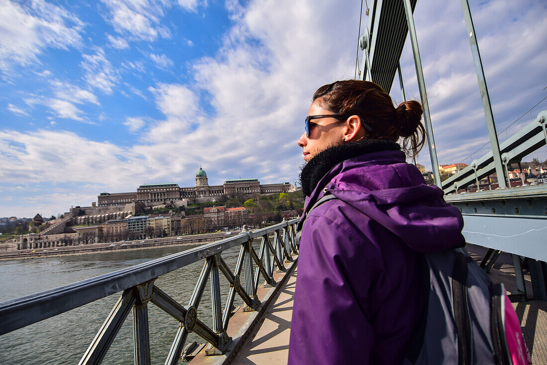 Szechenyi Chain Bridge in Budapest Young woman on Szechenyi Chain Bridge in Budapest