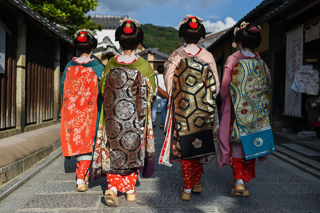 Group of women dressed as Maikos in the streets of Kyoto, Japan