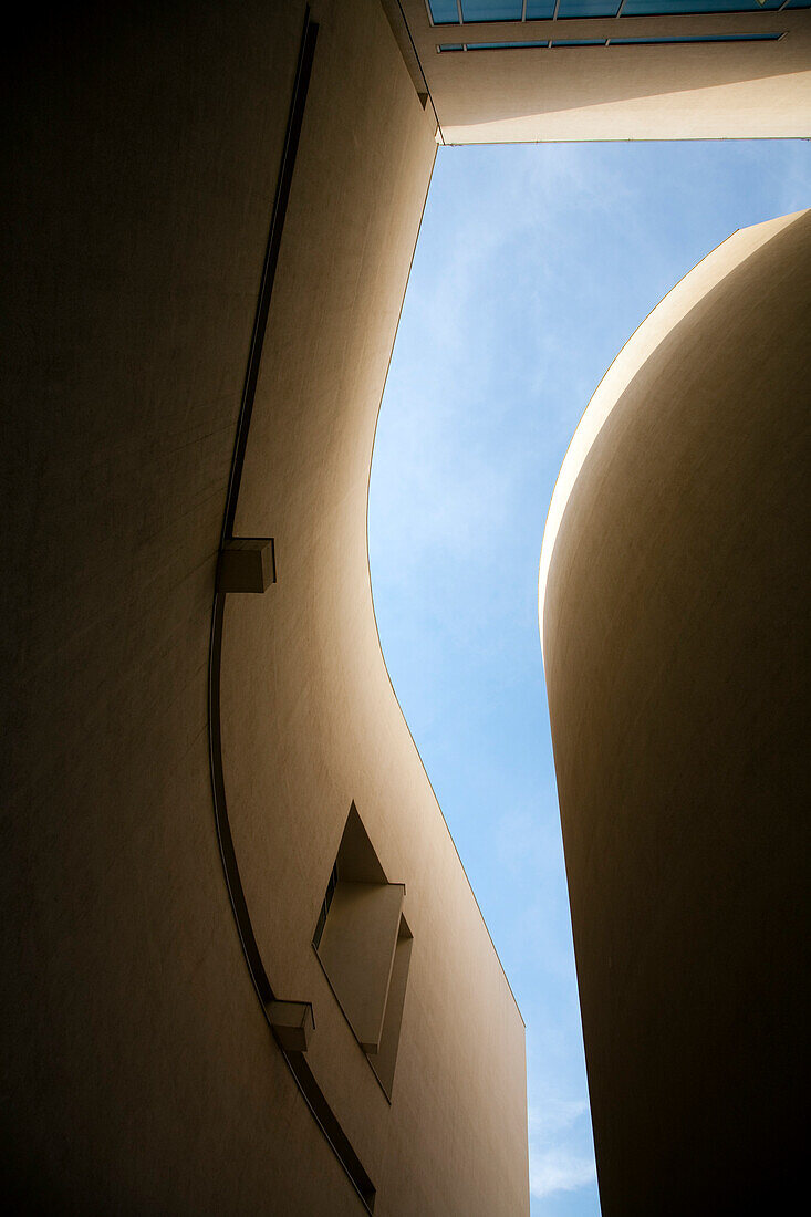 Curved lines and sharp angles create a striking view of the sky at MACBA, emphasizing contemporary architecture and design.