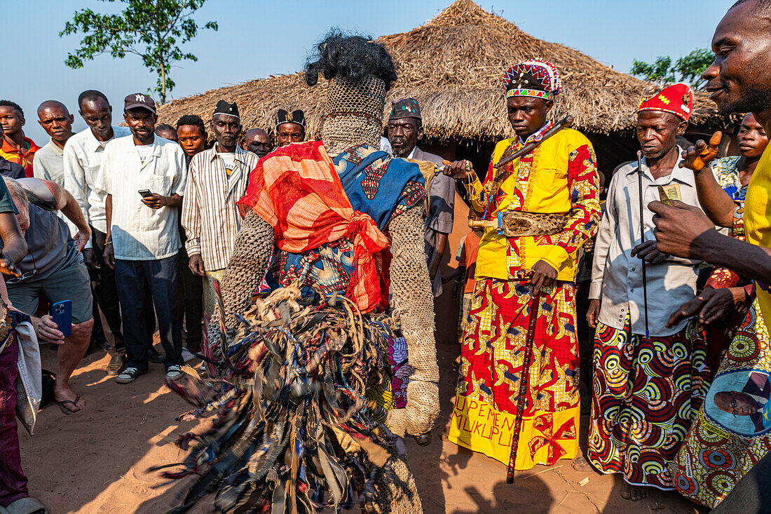 Traditional masked man dancing, Tshikapa, Kasai, Democratic Republic of Congo, Africa