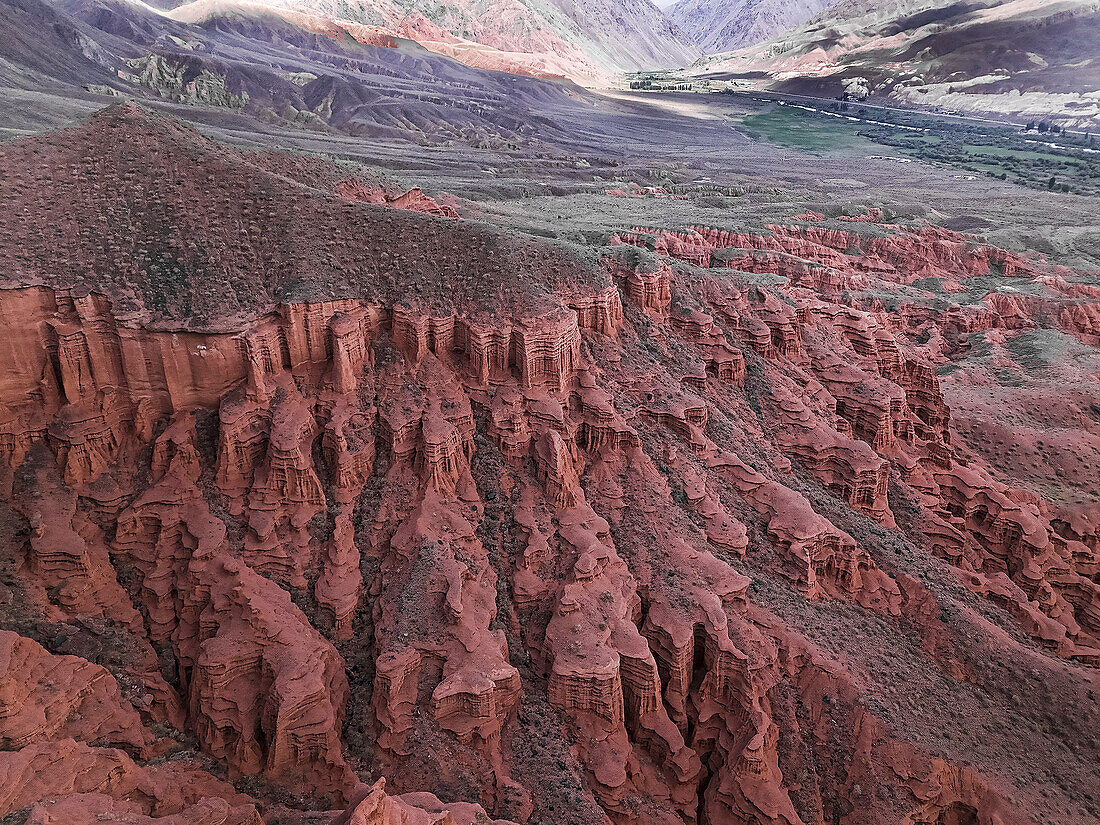 Kok-Moinok Canyon, a clay-sand structure formed on the slopes of arid mountains cut by water streams, Kyrgyzstan, Central Asia, Asia