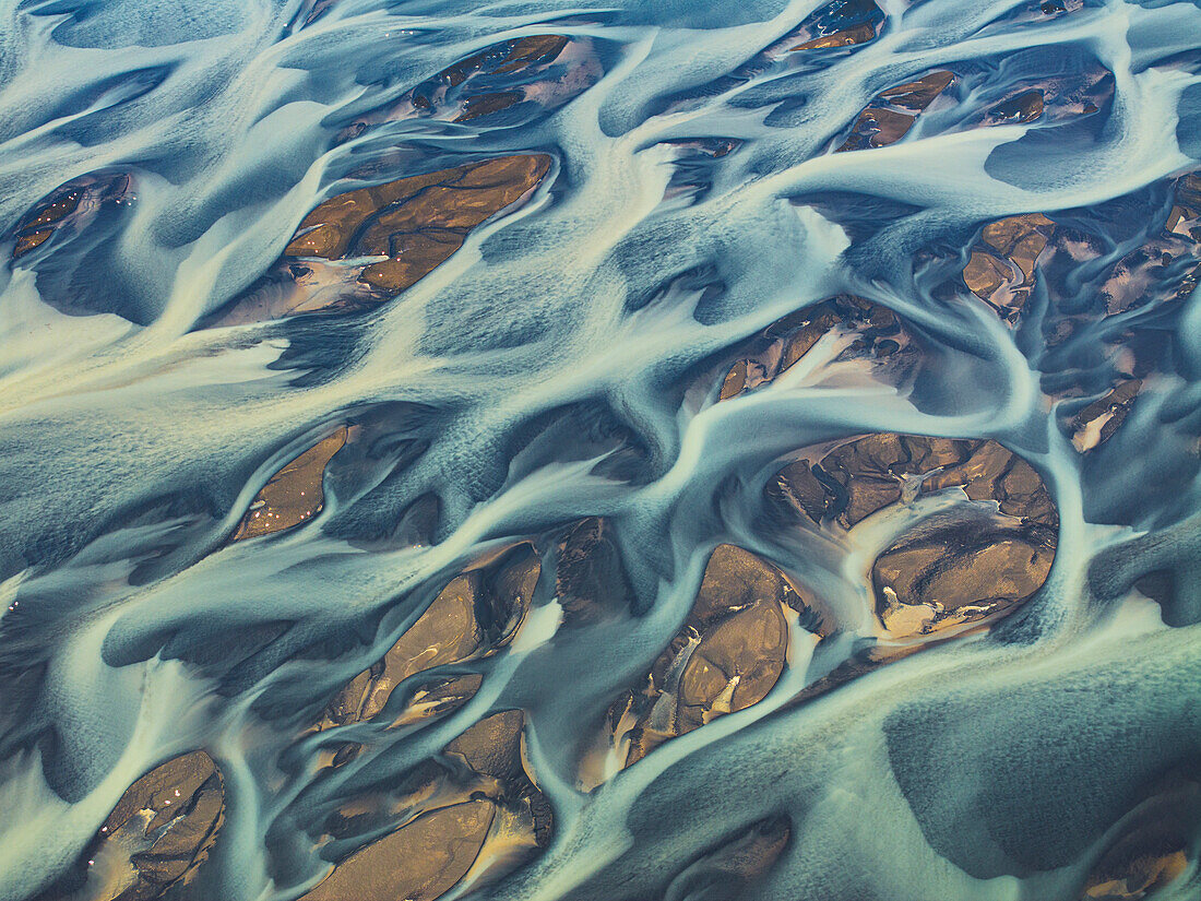 Aerial abstract view taken by drone of the textured river along the Icelandic southern coast, Iceland, Polar Regions