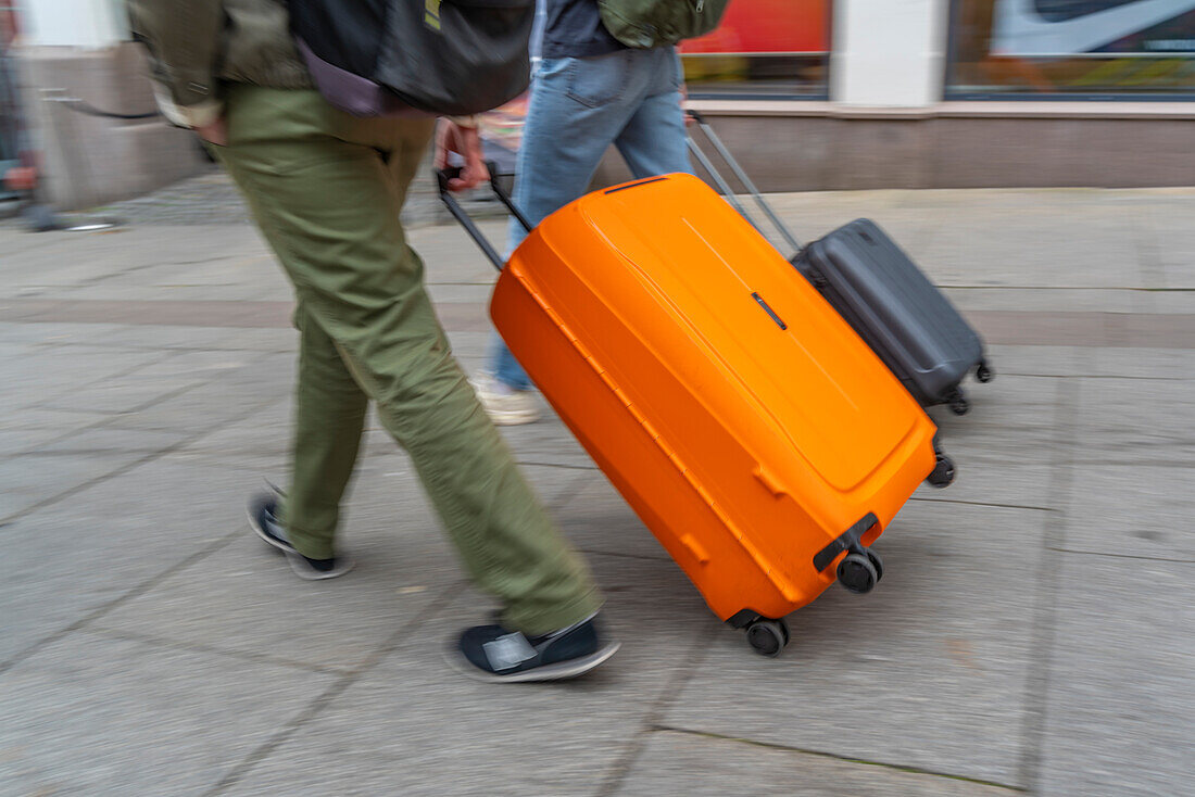 View of people with roller suitcases heading for Central Station, Oslo, Norway, Scandinavia, Europe