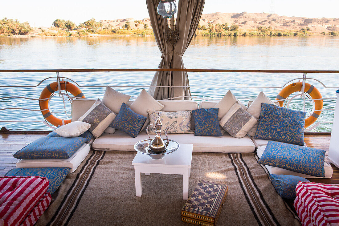 Lounge on the deck of a Dahabeah, passenger river boat of the Lazuli fleet, sailing on the Nile river, Egypt, North Africa, Africa