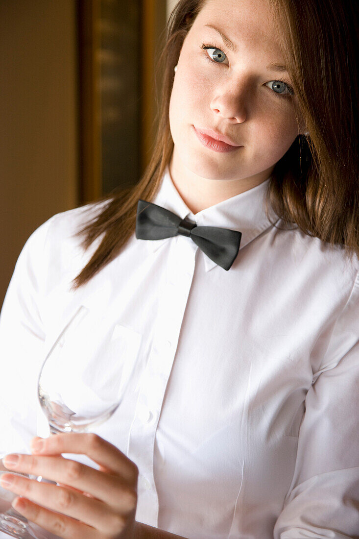 Waitress holding a wine glass