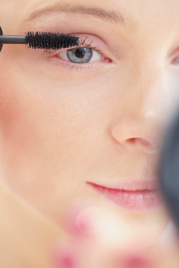 Close-up View of Woman Applying Mascara