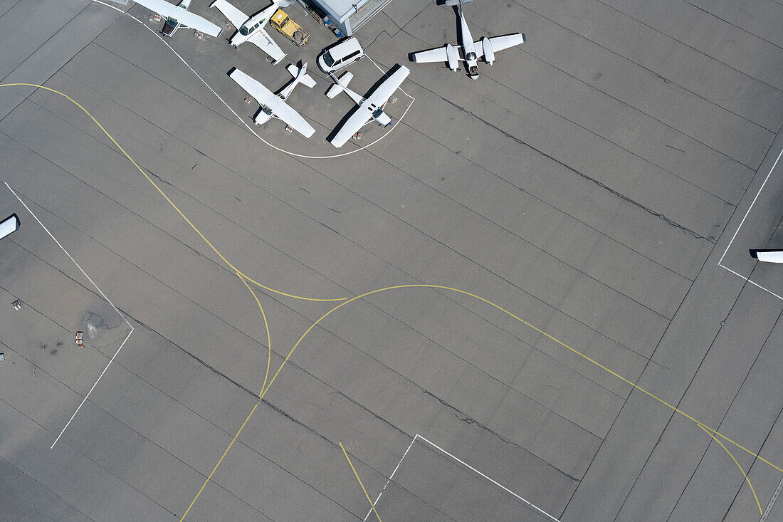 View from above propellor airplanes and lines on airport tarmac